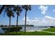 Scenic view of the water, palm trees, and clear sky, offering a serene outdoor setting at 6300 Flotilla Dr # 108, Holmes Beach, FL 34217