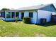 A well-maintained backyard showing an exterior with green grass and mature shrubbery for outdoor enjoyment at 6704 Rosemary Dr, Tampa, FL 33625