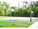 Outdoor basketball court with hoops, surrounded by trees and greenery, offering a great recreational area at 6704 Rosemary Dr, Tampa, FL 33625