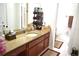 Bathroom featuring a large vanity with granite countertop, ample storage, and modern fixtures for everyday convenience at 6704 Rosemary Dr, Tampa, FL 33625