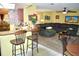 Open floor plan connecting the kitchen and living room, offering a seamless flow for entertaining and relaxation at 6704 Rosemary Dr, Tampa, FL 33625