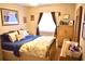 Cozy main bedroom with hardwood floors, natural light, and elegant furnishings offering a comfortable retreat at 6704 Rosemary Dr, Tampa, FL 33625
