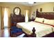 Comfortable bedroom with decorative headboard, hardwood floors, and natural light creating a serene atmosphere at 6704 Rosemary Dr, Tampa, FL 33625