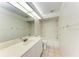 Bright bathroom featuring tile floors, a well-lit vanity, and a shower-tub combination at 7023 Woodside Oaks Cir # 1, Sarasota, FL 34231