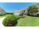 Charming one-story home with a well-manicured lawn and beautiful landscaping at 7023 Woodside Oaks Cir # 1, Sarasota, FL 34231