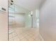 Open hallway with large mirrored shelving at 7023 Woodside Oaks Cir # 1, Sarasota, FL 34231