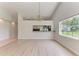 Spacious living room with wood floors and chandelier at 7023 Woodside Oaks Cir # 1, Sarasota, FL 34231