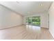 Spacious living room featuring recessed lighting and a ceiling fan at 7023 Woodside Oaks Cir # 1, Sarasota, FL 34231
