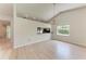 Spacious living room with wood floors and chandelier at 7023 Woodside Oaks Cir # 1, Sarasota, FL 34231