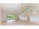 Living room featuring wood floors, chandelier, and an open floor plan at 7023 Woodside Oaks Cir # 1, Sarasota, FL 34231