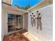 Cozy patio with red tile flooring and sliding glass doors at 7023 Woodside Oaks Cir # 1, Sarasota, FL 34231