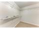 Walk-in closet featuring white shelving at 7023 Woodside Oaks Cir # 1, Sarasota, FL 34231