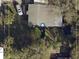 Aerial view of property showing the layout of the house and surrounding greenery at 7109 28Th E St, Sarasota, FL 34243