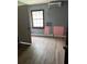Room showcases laminate flooring, a window and air conditioner unit at 7109 28Th E St, Sarasota, FL 34243