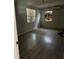 An empty bedroom features laminated flooring, a ceiling fan, and a window with closed blinds at 7109 28Th E St, Sarasota, FL 34243