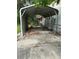 The exterior features a concrete carport with metal roof at 7109 28Th E St, Sarasota, FL 34243