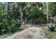 Fenced animal pen amongst mature trees and greenery on a rural property at 7251 Fish Farm Rd, Palmetto, FL 34221