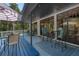 Spacious covered porch featuring outdoor seating and dining, perfect for entertaining at 7251 Fish Farm Rd, Palmetto, FL 34221