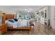 Large primary bedroom with a seating area, built-in storage, and many windows at 7251 Fish Farm Rd, Palmetto, FL 34221