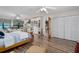 Bright bedroom features a full wall of built in shelving and storage, plus a separate desk area at 7251 Fish Farm Rd, Palmetto, FL 34221