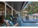 Spacious outdoor deck area with lounge chairs, patio furniture, and fire pit at 7251 Fish Farm Rd, Palmetto, FL 34221