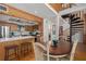 Dining area adjacent to an open kitchen and spiral staircase at 7251 Fish Farm Rd, Palmetto, FL 34221