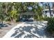 Long driveway with a covered carport and a truck providing ample parking space at 7251 Fish Farm Rd, Palmetto, FL 34221