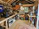 Well-equipped shed interior with a variety of tools, storage solutions, and ample workbench space at 7251 Fish Farm Rd, Palmetto, FL 34221