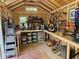 Organized shed interior with ample storage, a workbench, and tools neatly arranged at 7251 Fish Farm Rd, Palmetto, FL 34221