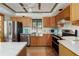 Modern kitchen features stainless steel appliances, light cabinets, and white countertops at 7251 Fish Farm Rd, Palmetto, FL 34221
