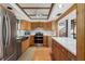 Well-equipped kitchen with custom cabinetry and a view of the spiral staircase at 7251 Fish Farm Rd, Palmetto, FL 34221