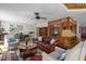 Inviting living room with plush seating, decorative rug, and views into the kitchen at 7251 Fish Farm Rd, Palmetto, FL 34221