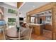 Open living space with wood accents, a kitchen bar, and a view of the living room at 7251 Fish Farm Rd, Palmetto, FL 34221