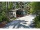 A versatile metal shed, perfect for storage, with additional space for parking vehicles at 7251 Fish Farm Rd, Palmetto, FL 34221
