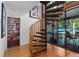 Unique spiral staircase with access to outdoor balcony and creative wall art at 7251 Fish Farm Rd, Palmetto, FL 34221