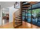 Interior shot highlighting spiral staircase and view to outdoor living area at 7251 Fish Farm Rd, Palmetto, FL 34221