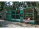 The property has a duck house with the traditional teal color scheme at 7251 Fish Farm Rd, Palmetto, FL 34221