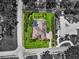 Aerial view of a private estate, with a pool, lush landscaping, and well-maintained grounds at 7321 Hemlock Ln, Sarasota, FL 34241