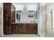 Bathroom featuring double vanity, granite countertop, walk in shower and great lighting at 7321 Hemlock Ln, Sarasota, FL 34241