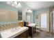 Bright bathroom featuring double vanities and a walk-in shower at 7321 Hemlock Ln, Sarasota, FL 34241