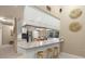 Open concept kitchen with island seating and stainless steel appliances at 7321 Hemlock Ln, Sarasota, FL 34241