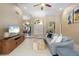Bright living room with tile floors, comfortable seating, and a view of the entryway at 7321 Hemlock Ln, Sarasota, FL 34241