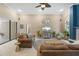 Spacious living room with tile floors, high ceilings, and lots of natural light at 7321 Hemlock Ln, Sarasota, FL 34241