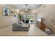 Comfortable living room with tile floors, access to the screened patio, and plenty of natural light at 7321 Hemlock Ln, Sarasota, FL 34241