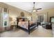 Spacious main bedroom with ceiling fan and ensuite bath at 7321 Hemlock Ln, Sarasota, FL 34241