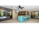 Covered outdoor bar area complete with seating, TV, and easy access to the kitchen at 7321 Hemlock Ln, Sarasota, FL 34241
