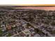 Aerial view of a residential neighborhood with tree-lined streets and homes near a bay at 7404 13Th Avenue W Dr, Bradenton, FL 34209