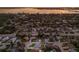 Aerial view of a residential neighborhood near the water at sunset at 7404 13Th Avenue W Dr, Bradenton, FL 34209