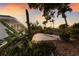 Tropical backyard with native plants and a lovely concrete patio at 7404 13Th Avenue W Dr, Bradenton, FL 34209