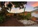 Landscaped backyard featuring a wooden fence and colorful plants at 7404 13Th Avenue W Dr, Bradenton, FL 34209